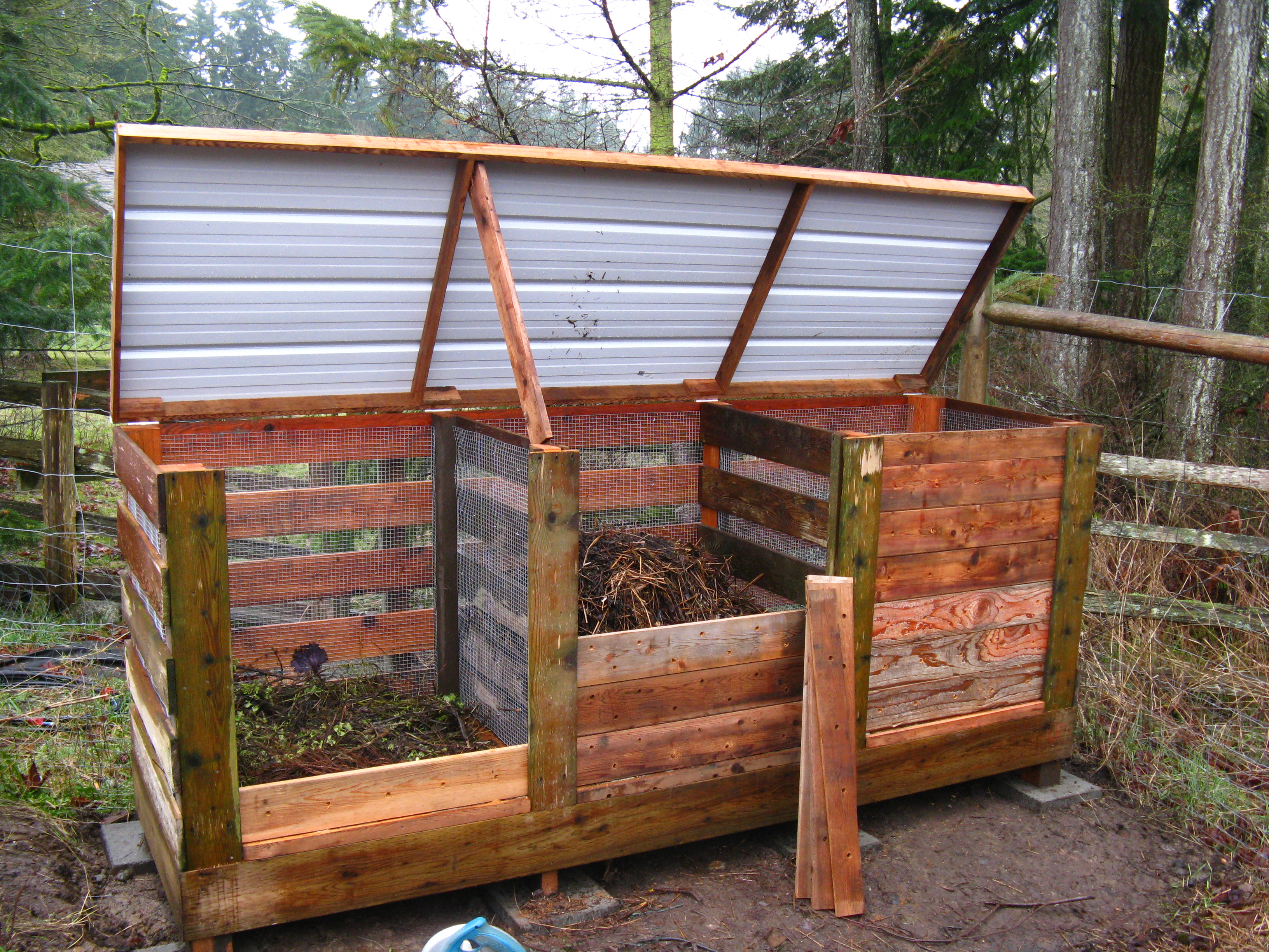 Complete! New metal roof, and compost curing in its new home.